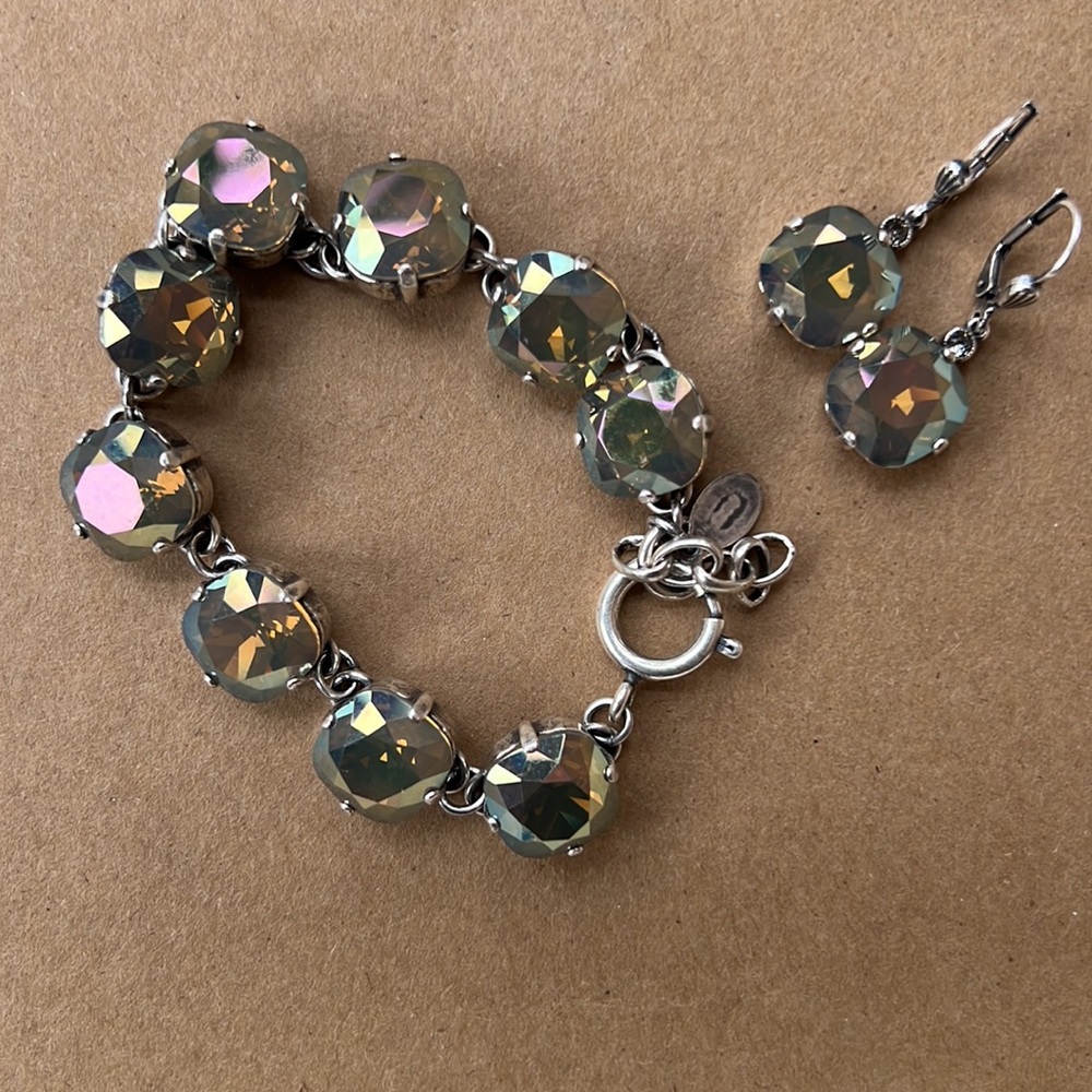 Beautiful metallic color over silver set. NWOT.